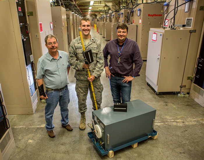 Michael Sherburne with Colleagues in the NIF Capacitor Bay