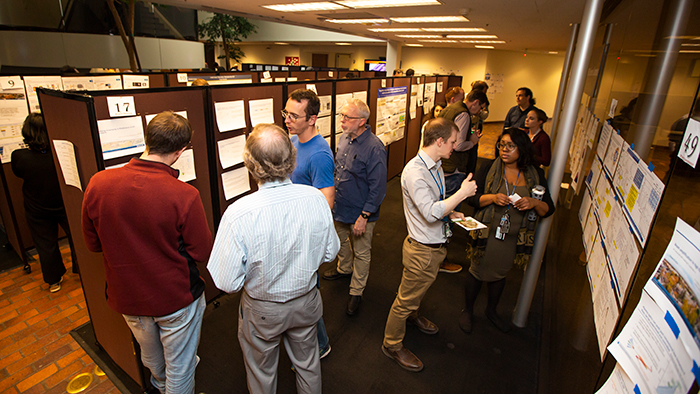 Photo APS Poster Social attendees discussing their research