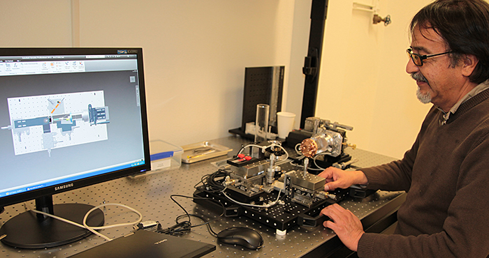 Photo from 2013 of LLNL Senior Engineering Associate Carlos Castro Carlos Castro developing a multi-view target assembly.