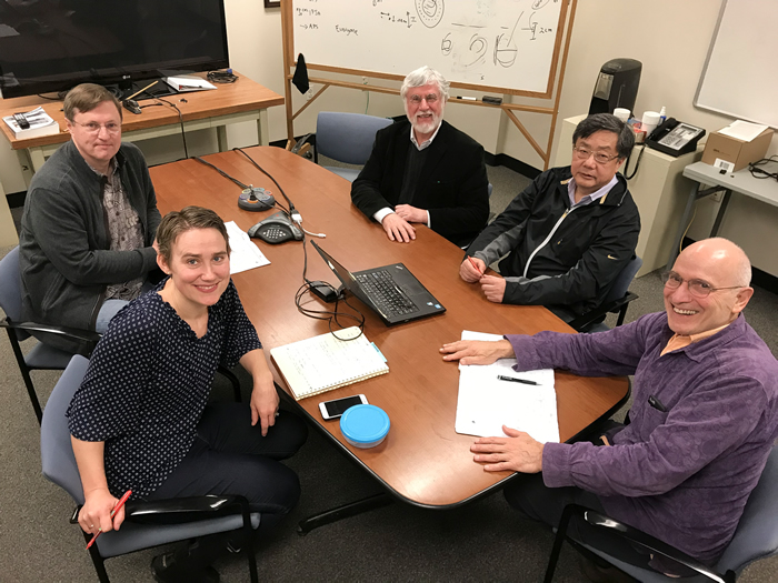 MIT Researchers at a Conference Table