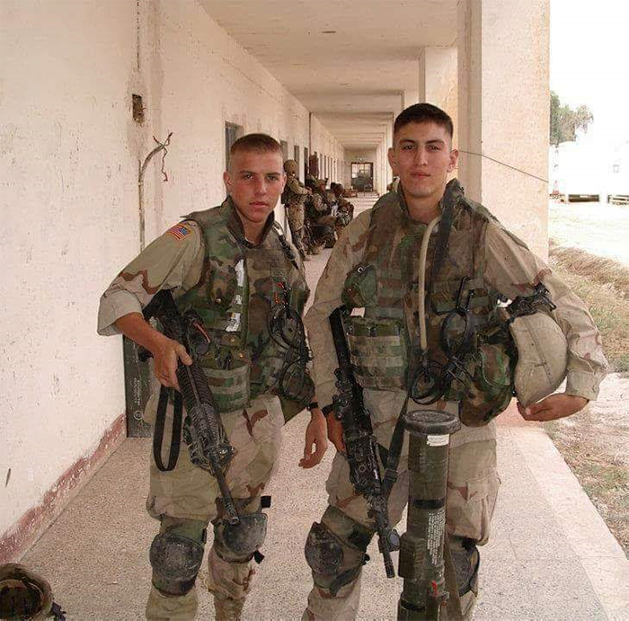 Photo of John Ruiz, right, and a fellow squad member in uniform in Iraq