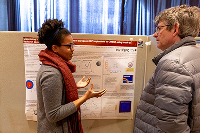Photo of MIT student Raspberry Simpson speaking with Professor Michel Koenig