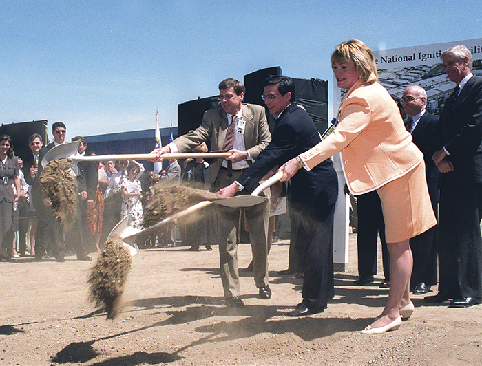 Photo of then-Congresswoman Ellen Tauscher shoveling dirt at NIF groundbreaking