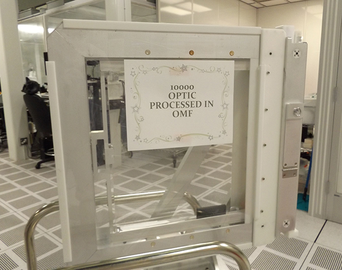 Photo of the 10,000th optic processed by the Optics Mitigation Facility