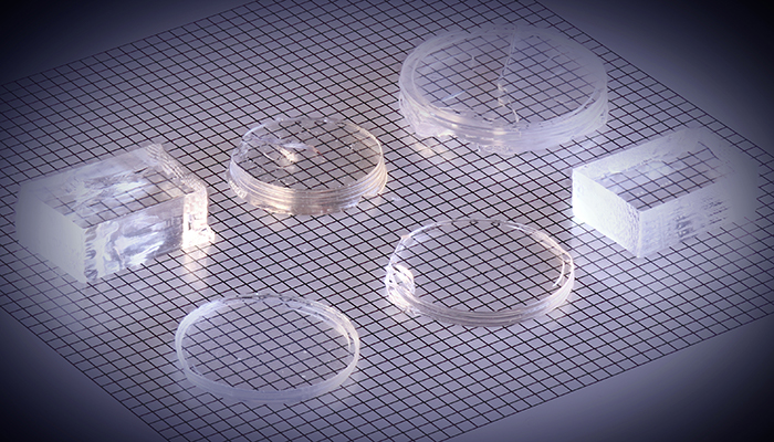 An array of polished, 3D printed gradient refractive index lenses made of titania-doped silica glass