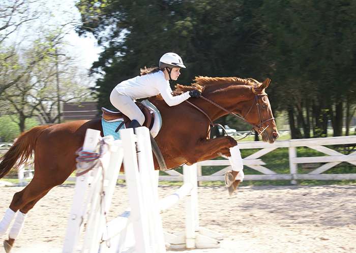 Photo of Kelli Humbird riding a horse