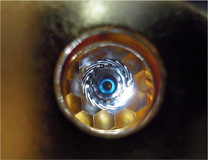 Photo of cryogenically cooled NIF target as seen by the laser through the hohlraum laser entrance hole