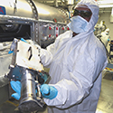 Operator Removes Neutron Imager Snout from a Diagnostic Instrument Manipulator