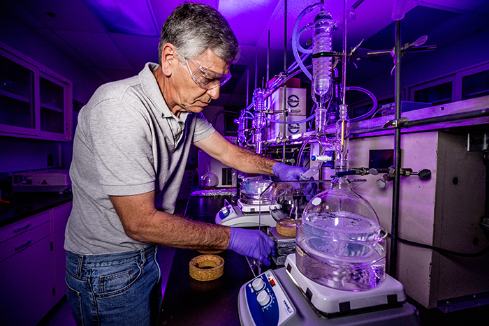 Photo of LLNL Chemist Paul Ehrmann preparing anti-reflective coating