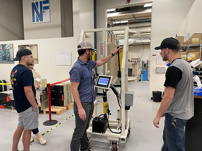 Chico State team demonstrates the door lifting device at NIF