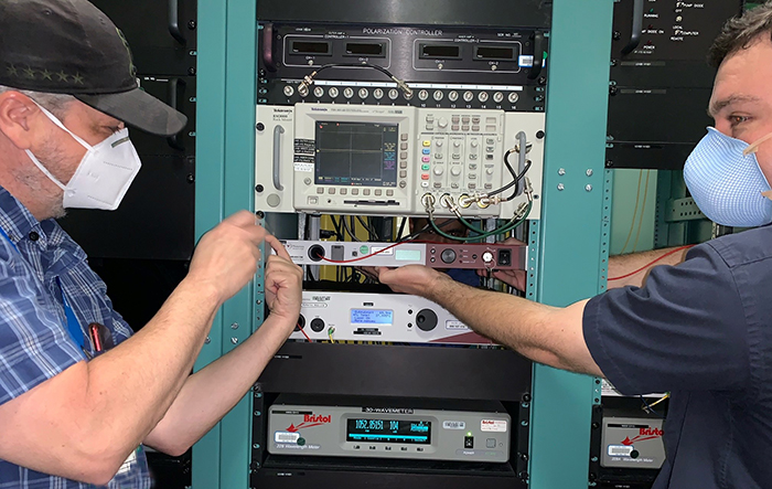 MOR staff members Chris Kinsella and Matt Prantil install hardware