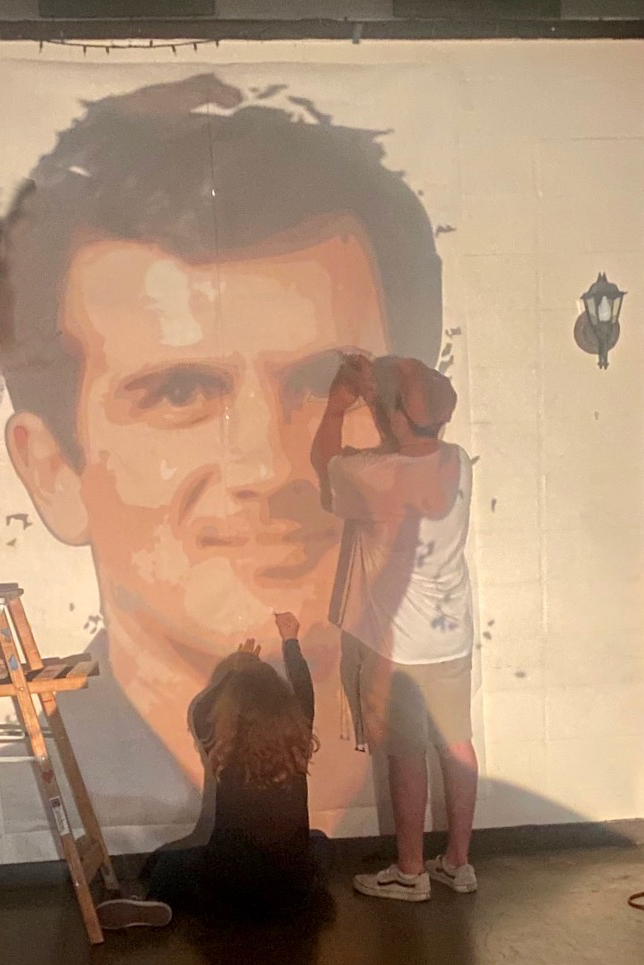The muralists began the project by projecting the images of each astronaut’s face and torso, like this image of Jeff Wisoff, on the wall