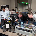 LLNL Deputy Laser Safety Officer Hayden Johnson shows the NIF&PS educational outreach 3-laser demo to fellow attendees at the 2023 International Laser Safety Conference