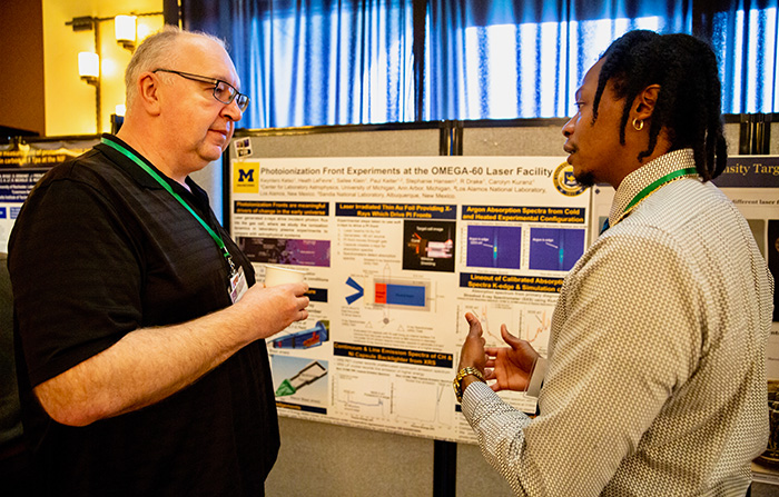 Kwyntero Kelso, a graduate student at the University of Michigan discusses his poster