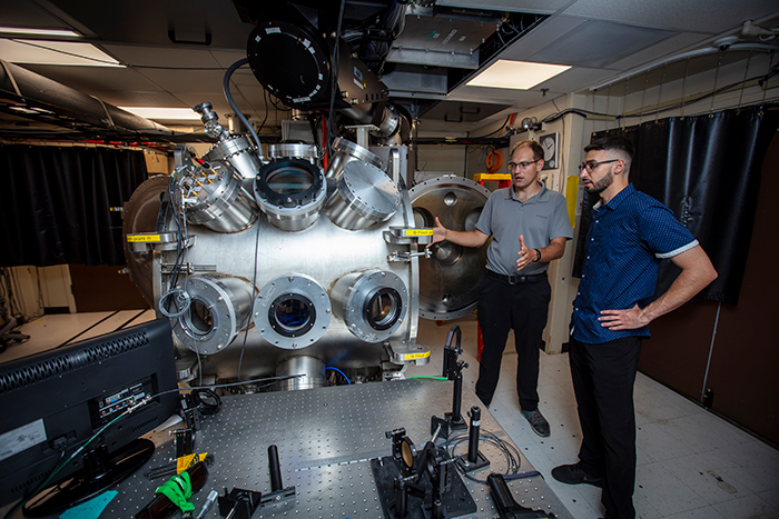 LLNL intern Danny Attiyah, right, and his mentor Andrew Longman at the Jupiter Laser Facility