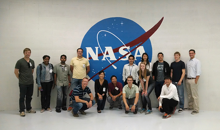 Zhi Liao, kneeling at center, brings a NIF&PS Summer Scholar Program group to tour NASA’s Ames Research Center in Mountain View in 2014.