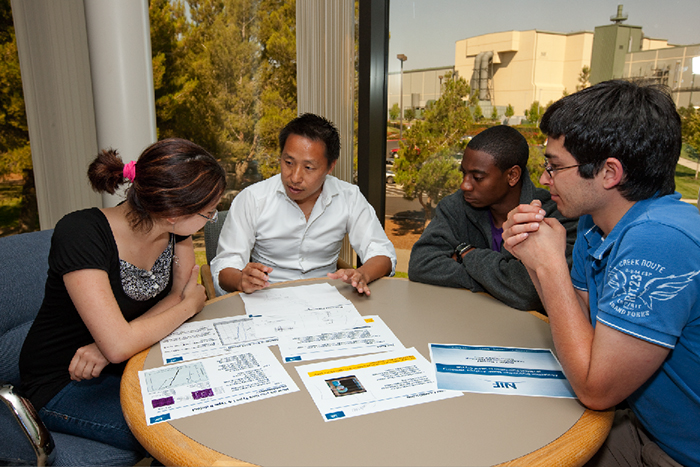 Zhi Liao, the new NIF & Photon Science (NIF&PS) workforce manager, works with NIF&PS Summer Scholar Program students in 2010
