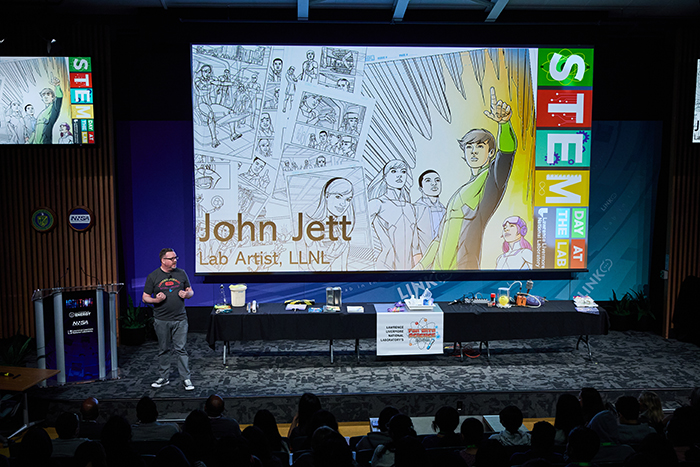 LLNL artist John Jett speaking to a STEM Day audience