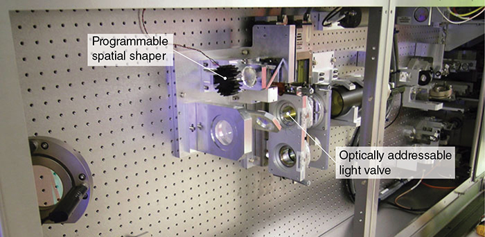Labeled components within an assembly of parts for a laser system