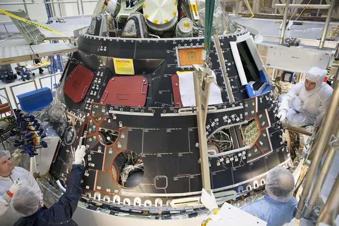 Technicians Install Orion Heat Shield